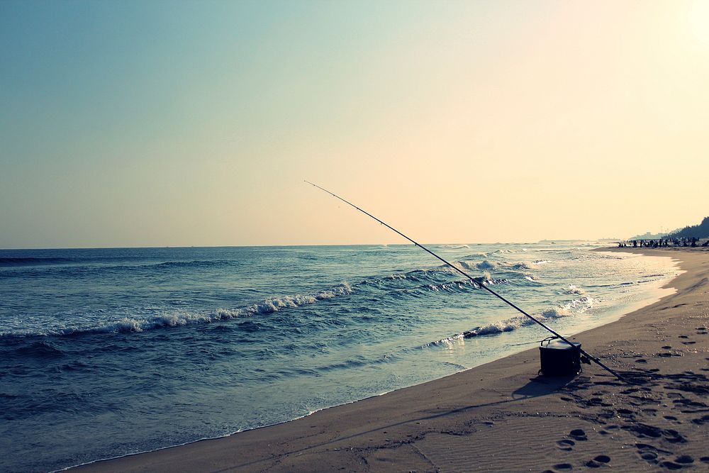 Fishing rod in beach sea. Free public domain CC0 image.