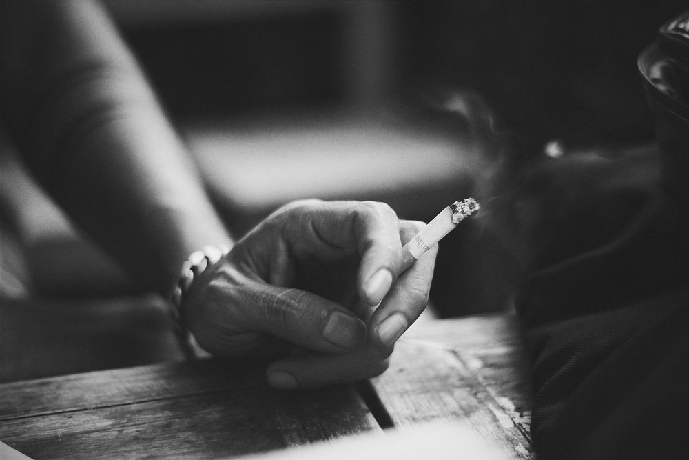 Woman smoking cigarette. Free public domain CC0 photo.