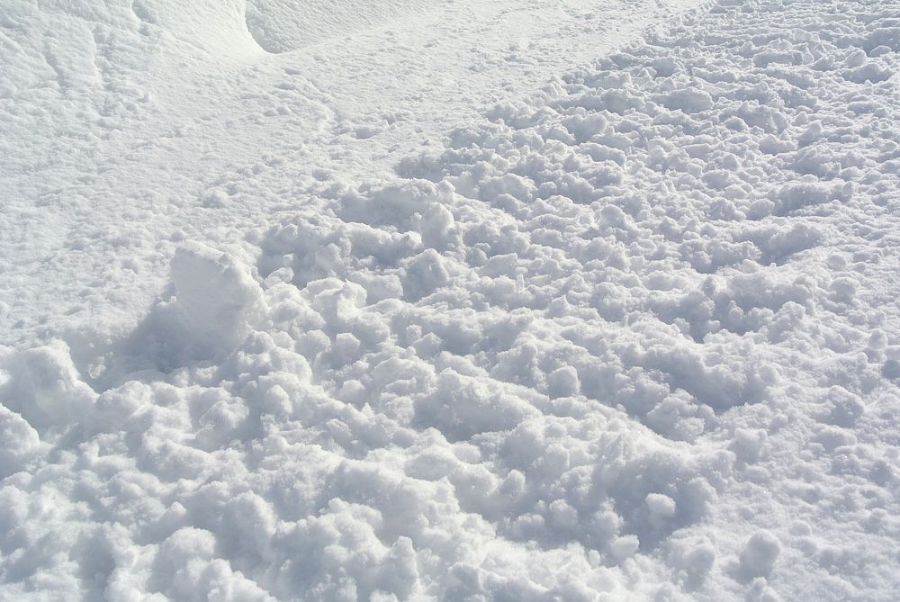 Closeup on ground covered in snow. Free public domain CC0 image. 