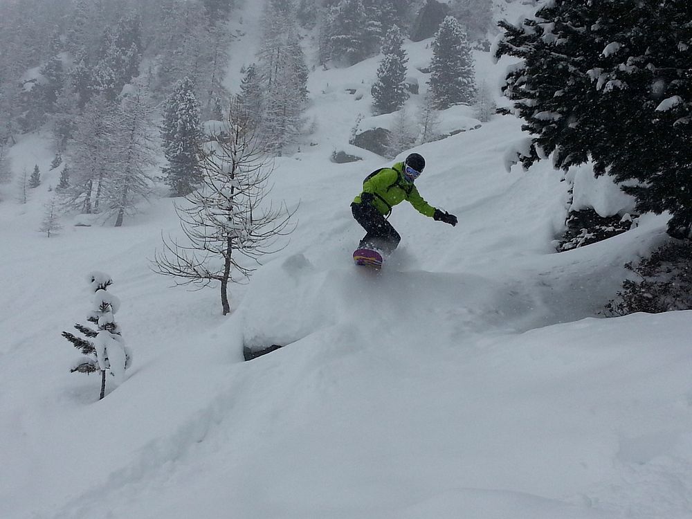 Snowboarder going off piste. Free public domain CC0 photo.