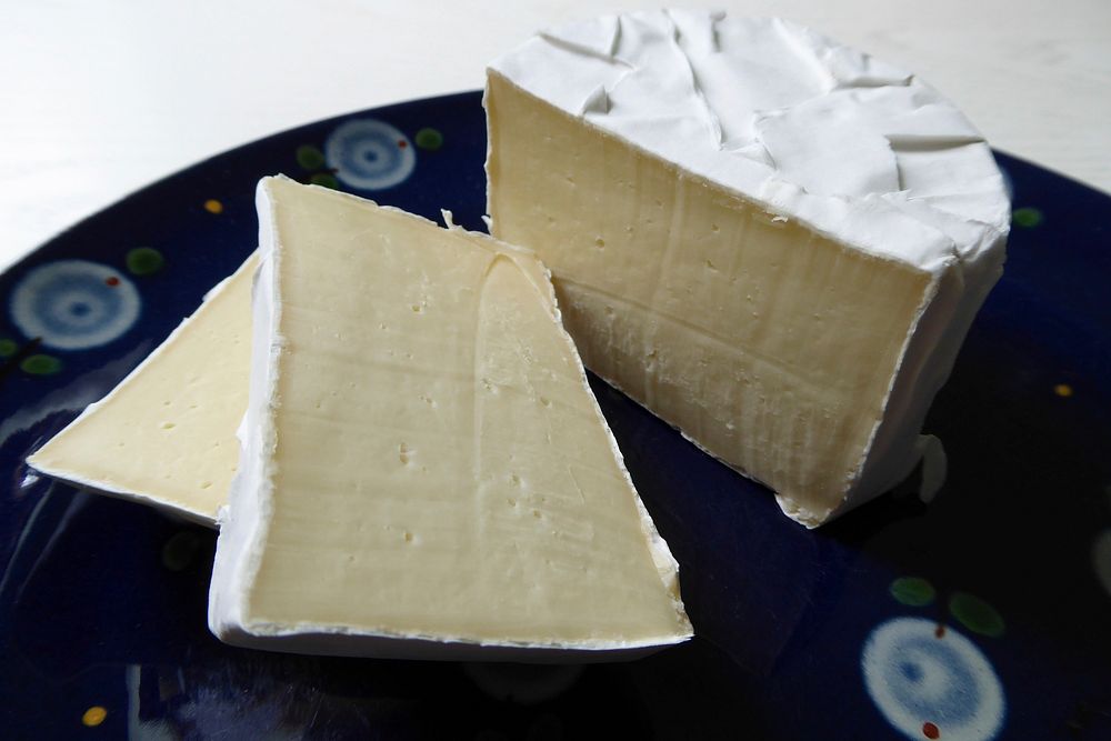 Closeup on sliced Brie cheese. Free public domain CC0 photo.