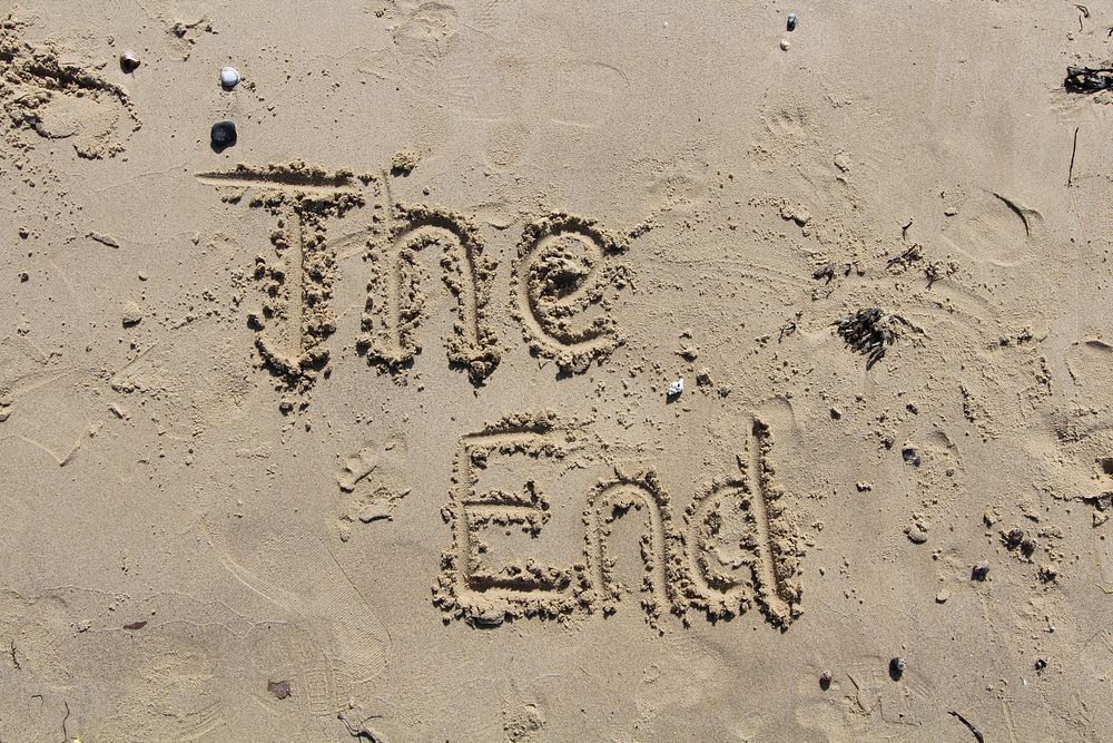 The end written in sand. Free public domain CC0 image.