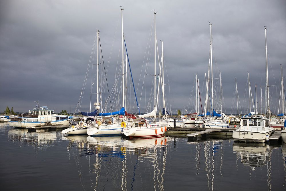 Yacht docking by the marina. Free public domain CC0 photo.