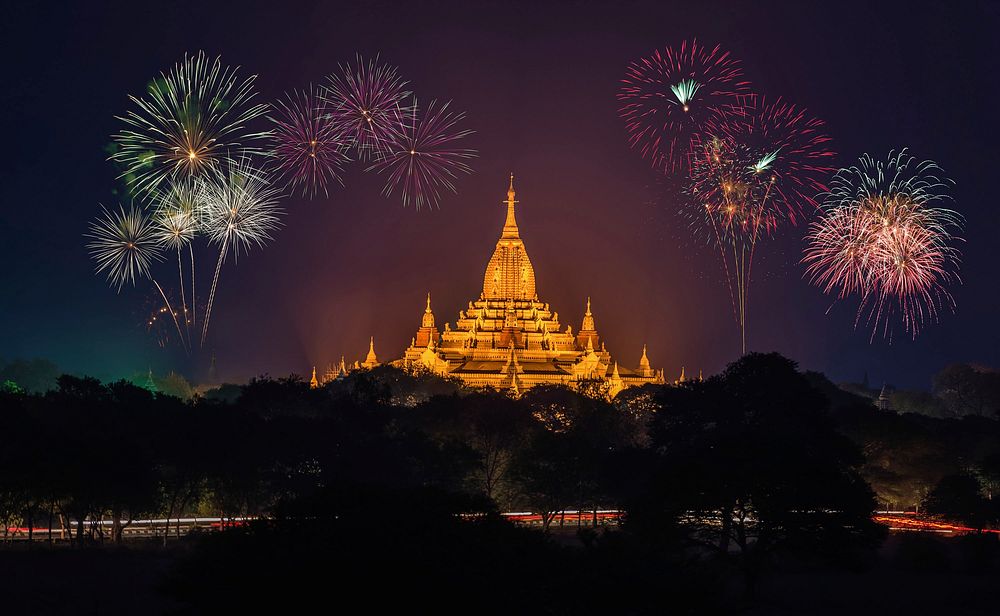 Free fireworks above stupa photo, public domain celebration CC0 image.