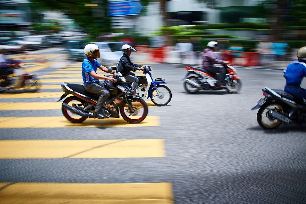 Moped riders, Asia city traffic.  Free public domain CC0 photo.