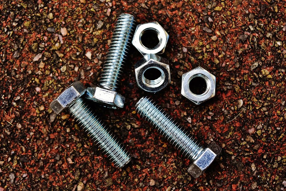 Silver hex nuts and bolt. Free public domain CC0 photo.