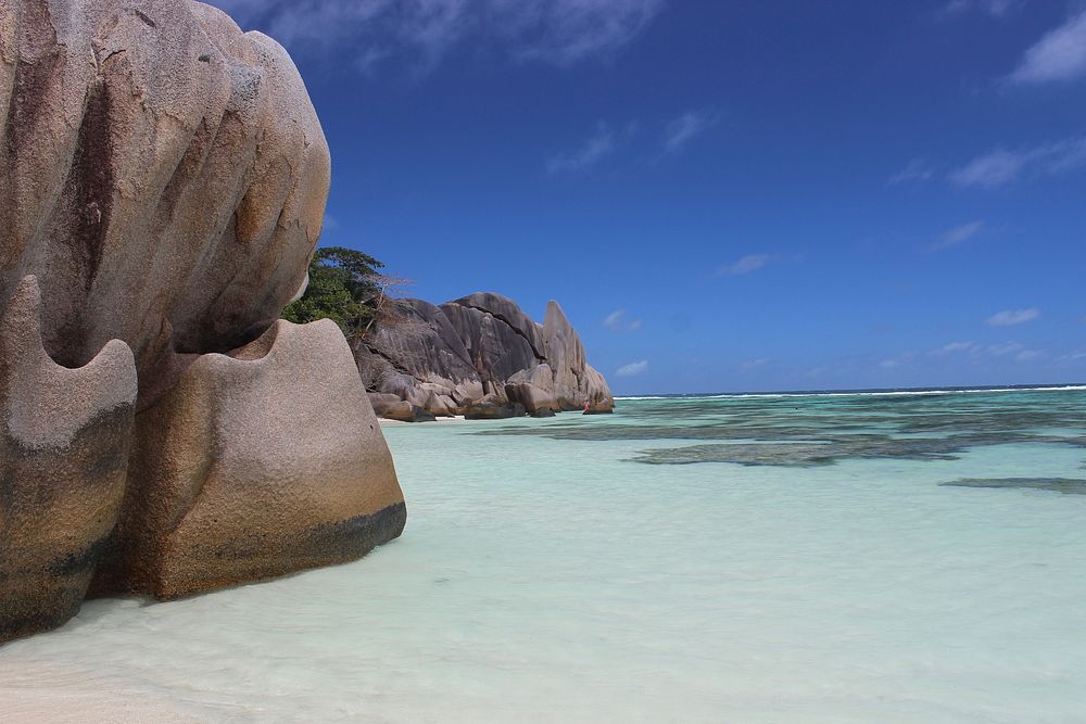 Tropical island beach in Seychelles. Free public domain CC0 image.