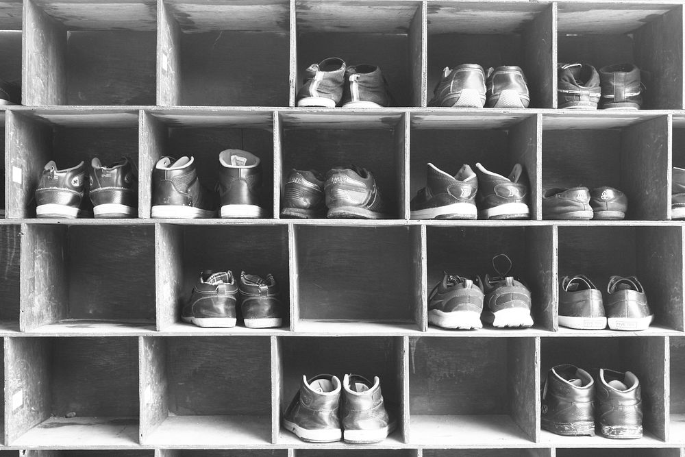 Old shoes on a wooden shelf. Free public domain CC0 image