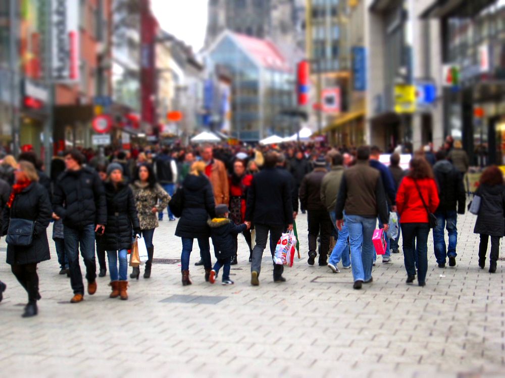 Crowded street with people wearing jacket. Free public domain CC0 image