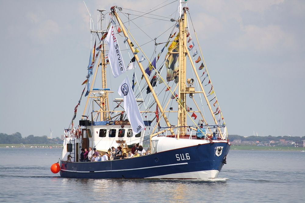 Sailing blue fishing boat. Free public domain CC0 photo.