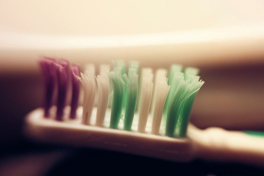 Free used toothbrush with worn out bristles image, public domain CC0 photo.