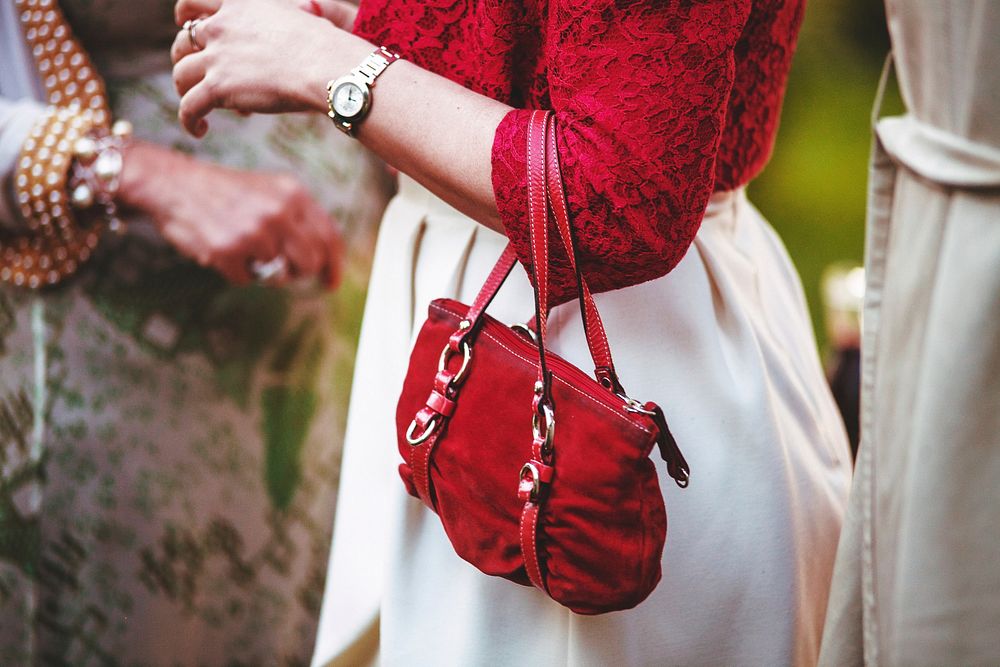 Free dressed up woman holding a red bag photo, public domain CC0 image.