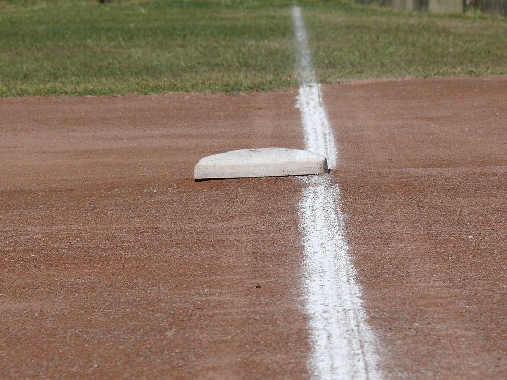 Closeup on a baseball base. Free public domain CC0 photo.