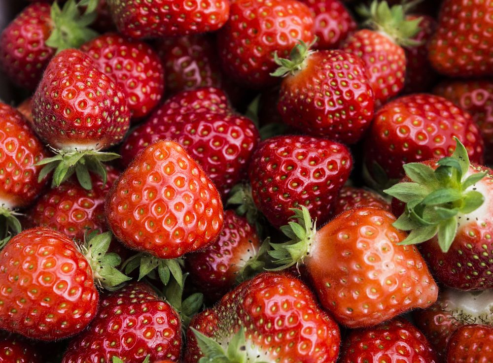 Closeup on pile of fresh strawberries. Free public domain CC0 image. 