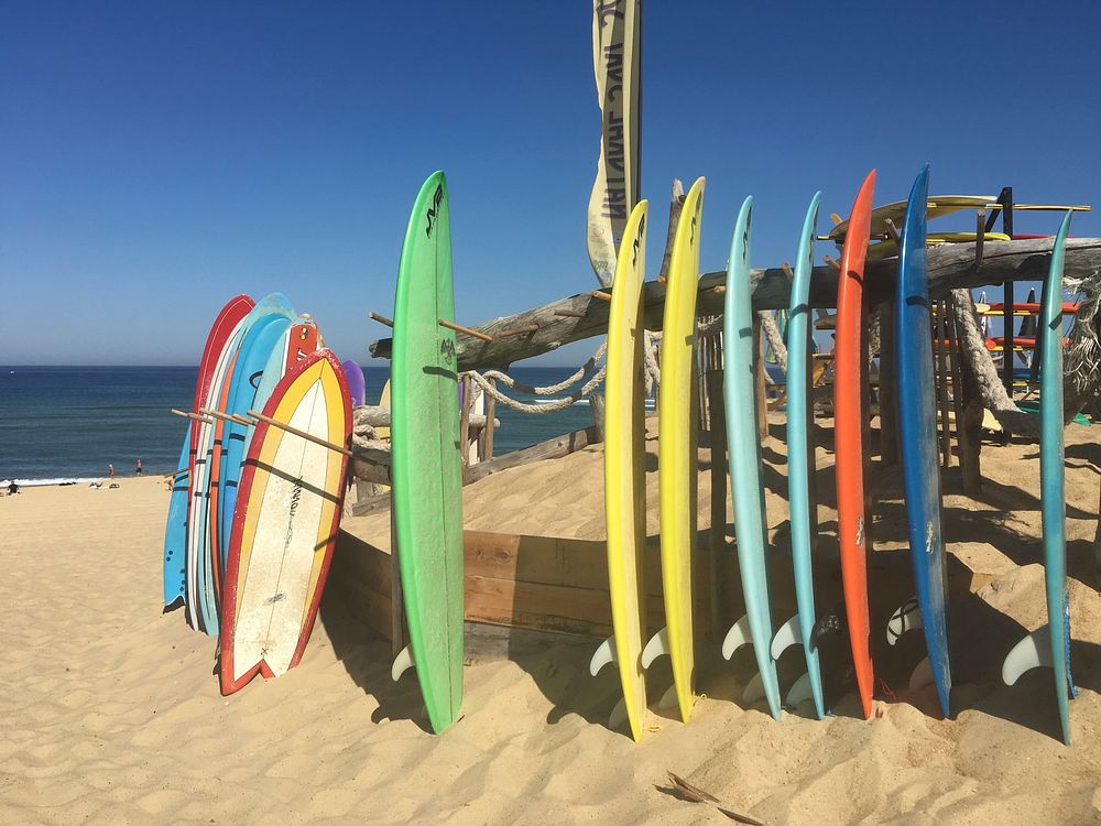 Surfboards lined up, sports photography. Free public domain CC0 image.