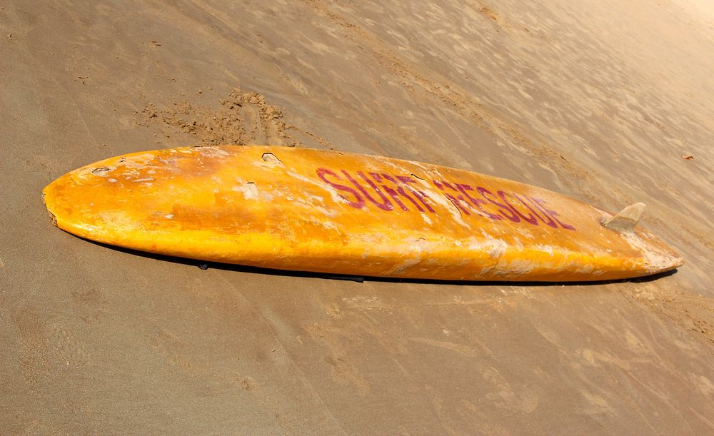 Closeup on surfboard on beach. Free public domain CC0 photo.