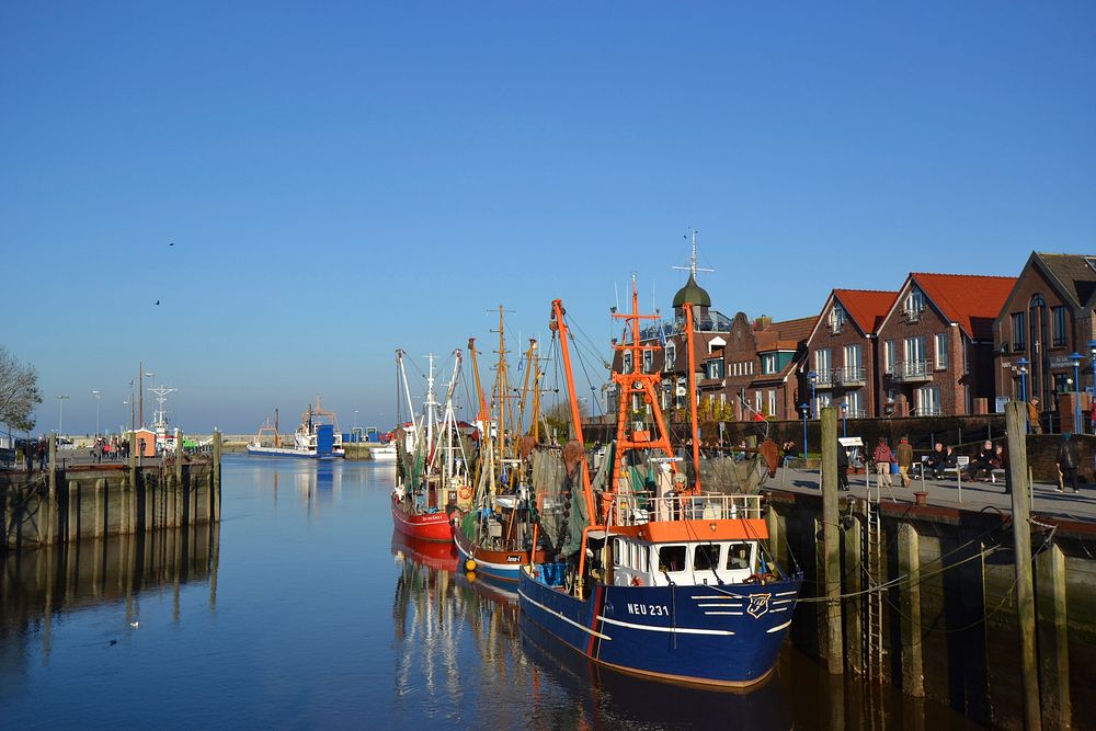 Boat docked by the port. Free public domain CC0 photo.