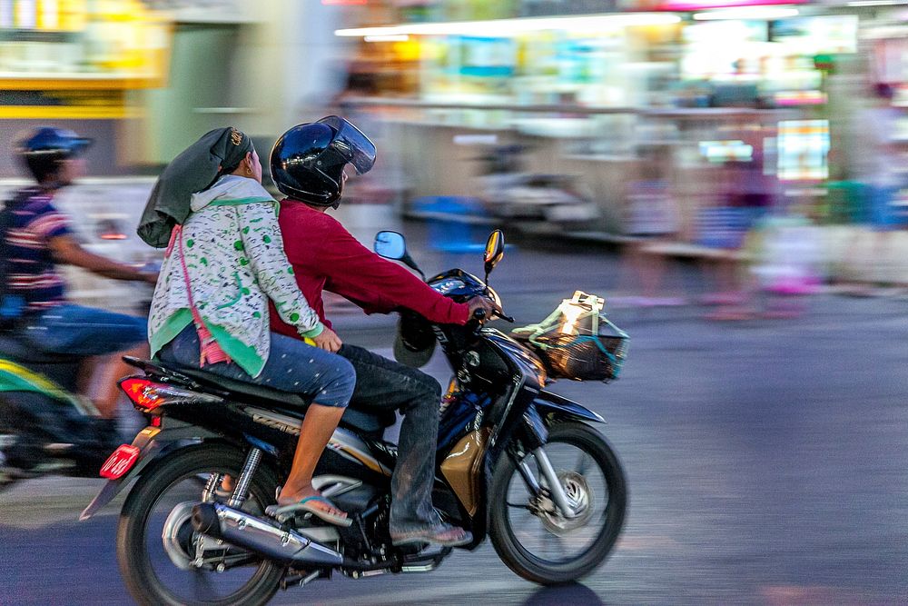 Couple on motorbike in Thailand. Free public domain CC0 photo