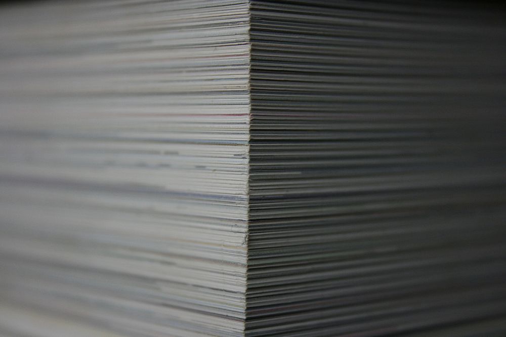 Paperwork pile closeup. Free public domain CC0 photo.