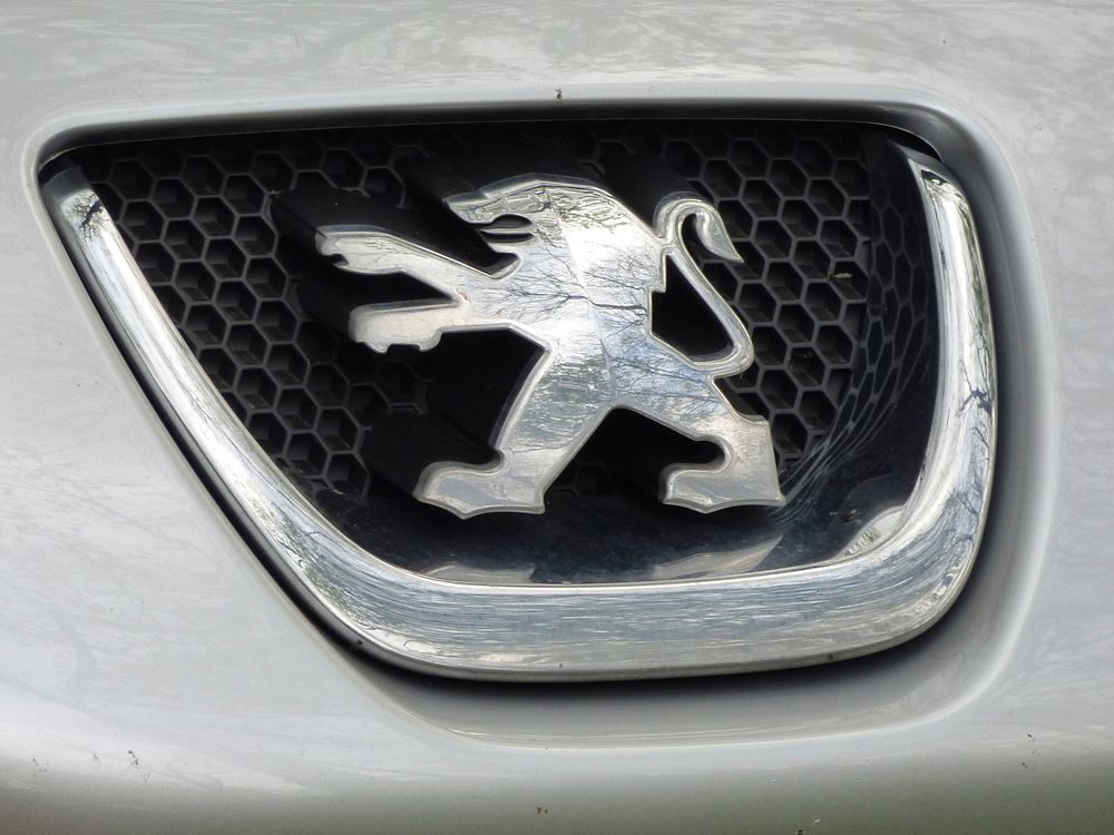 Peugeot logo, luxury auto car. Location unknown - April 27, 2014