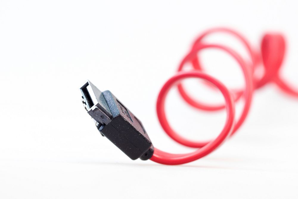 USB with red wire. Free public domain CC0 photo.