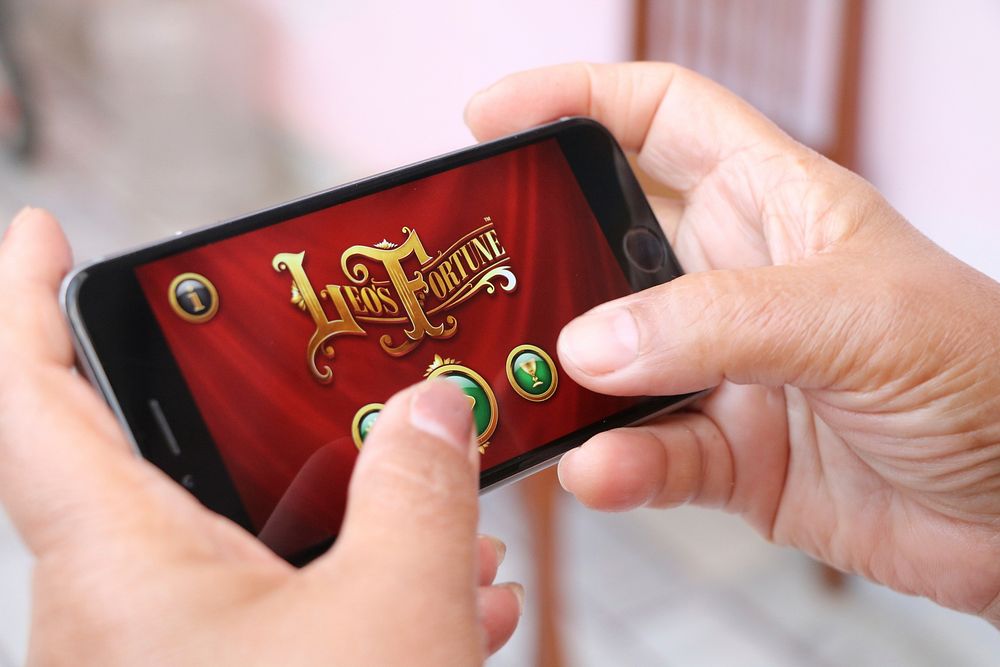 Person playing Leo's Fortune game on iPhone, location unknown, 4 February 2016.