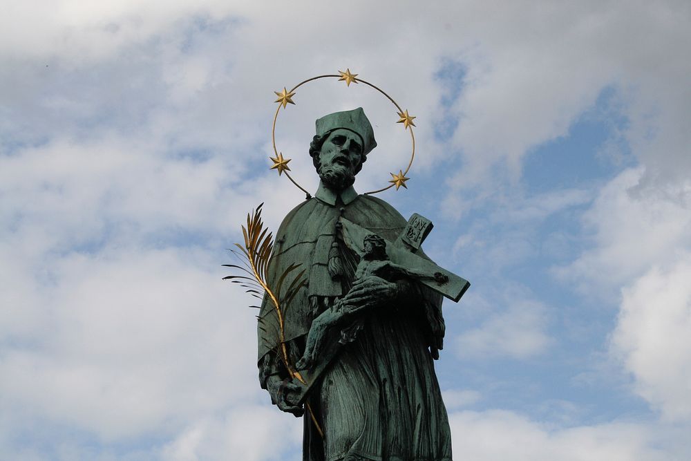 Saint John of Nepomuk statue Charles Bridge Prague. Free public domain CC0 photo.