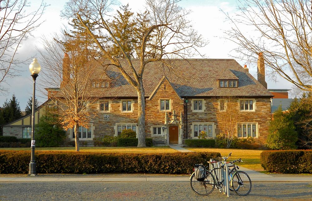 Bicycle in front of a big mansion. Free public domain CC0 photo.