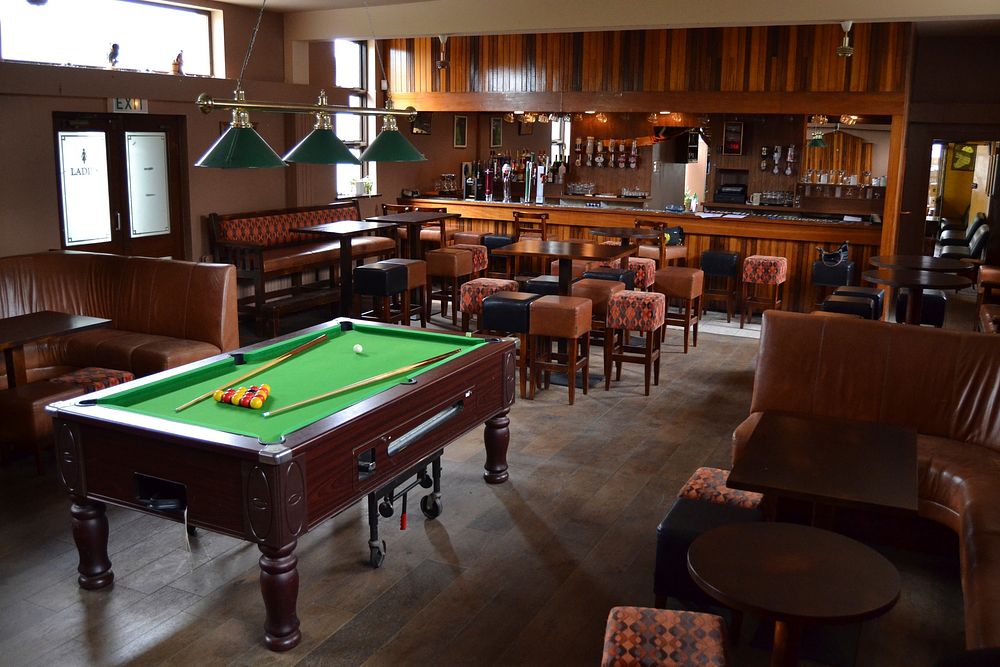 Pool table, wooden room. Free public domain CC0 image.