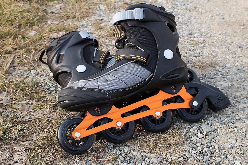 Closeup on inline skates on ground. Free public domain CC0 photo.