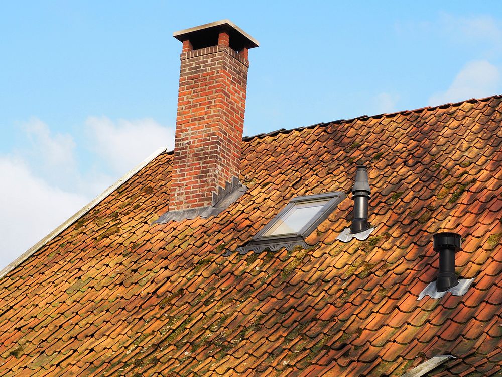 Roof with chimney. Free public domain CC0 photo.