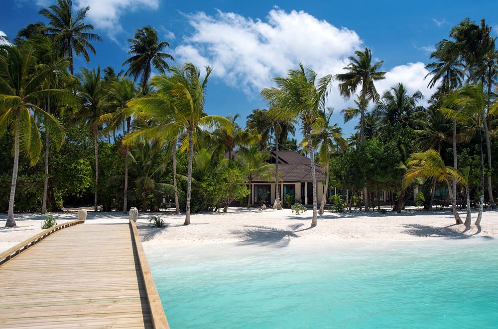 Maldives island beach front resort. Free public domain CC0 photo.