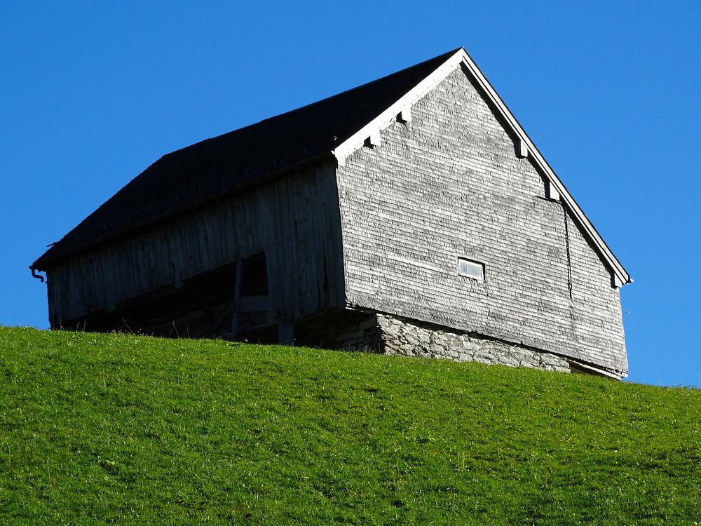 Wooden barn in a countryside. Free public domain CC0 image.