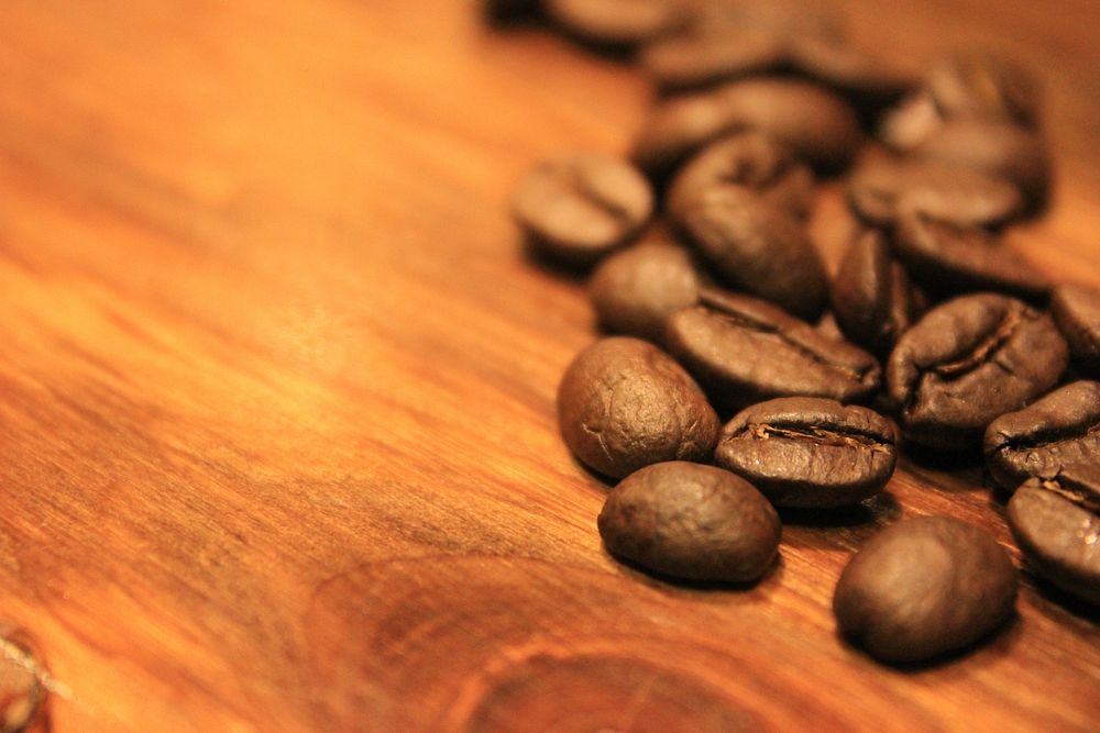 Coffee beans on a table. Free public domain CC0 photo