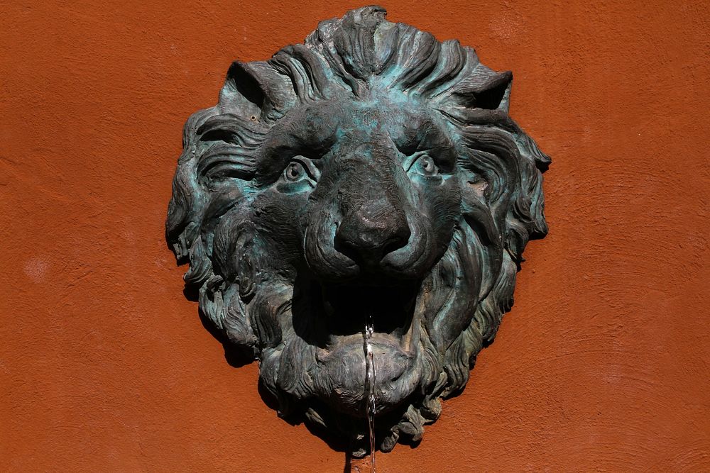 Lion head sculpture. Free public domain CC0 image.