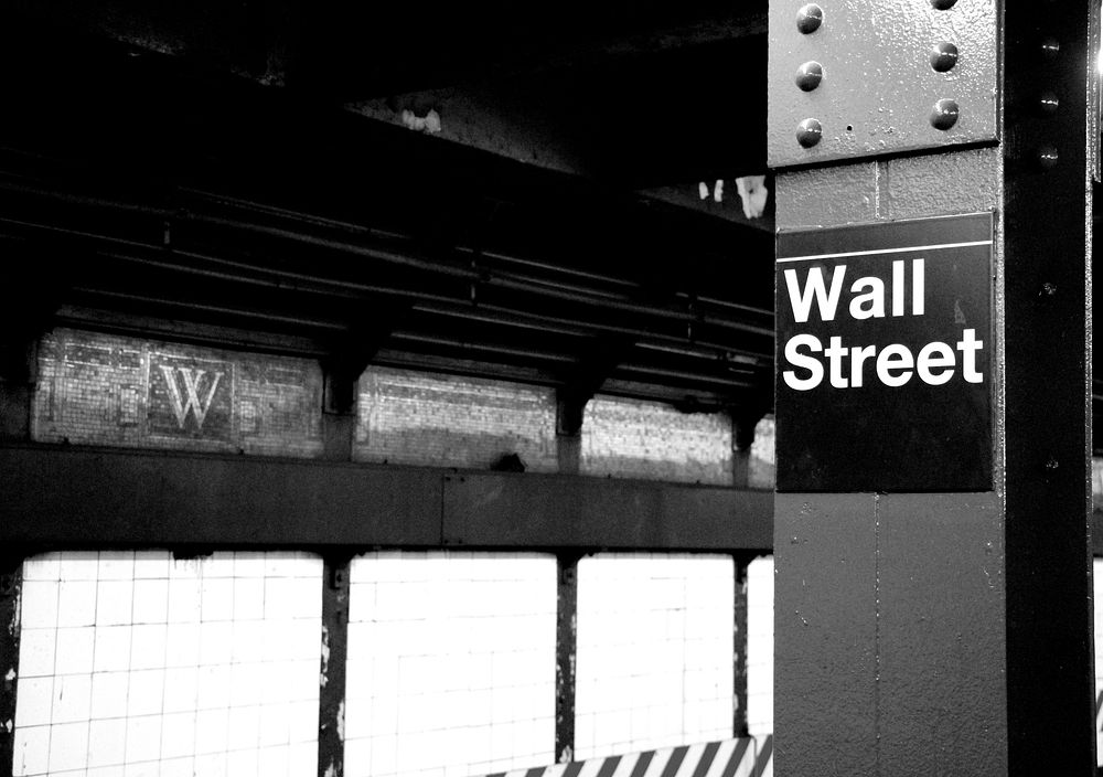Wall Street sign at the train station. Free public domain CC0 photo.
