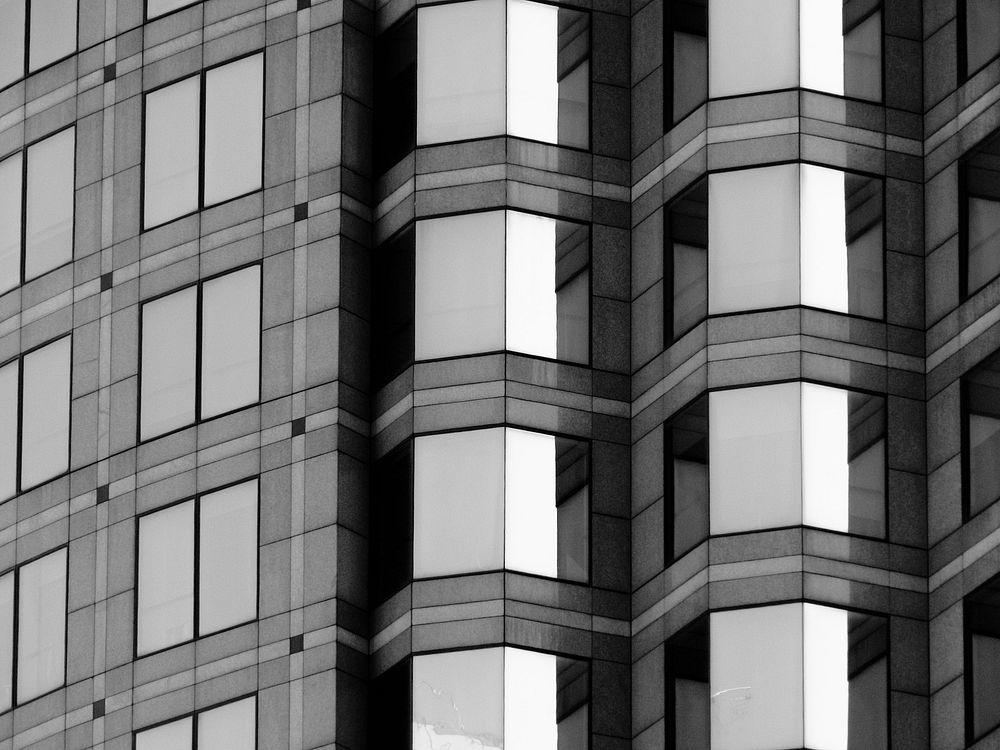 Abstract skyscraper symmetry in black and white. Free public domain CC0 photo.