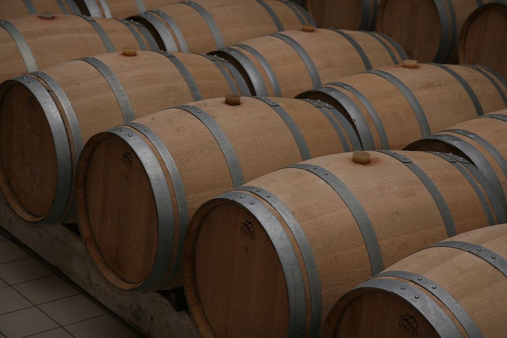 Barrels in a winery in France. Free public domain CC0 photo.