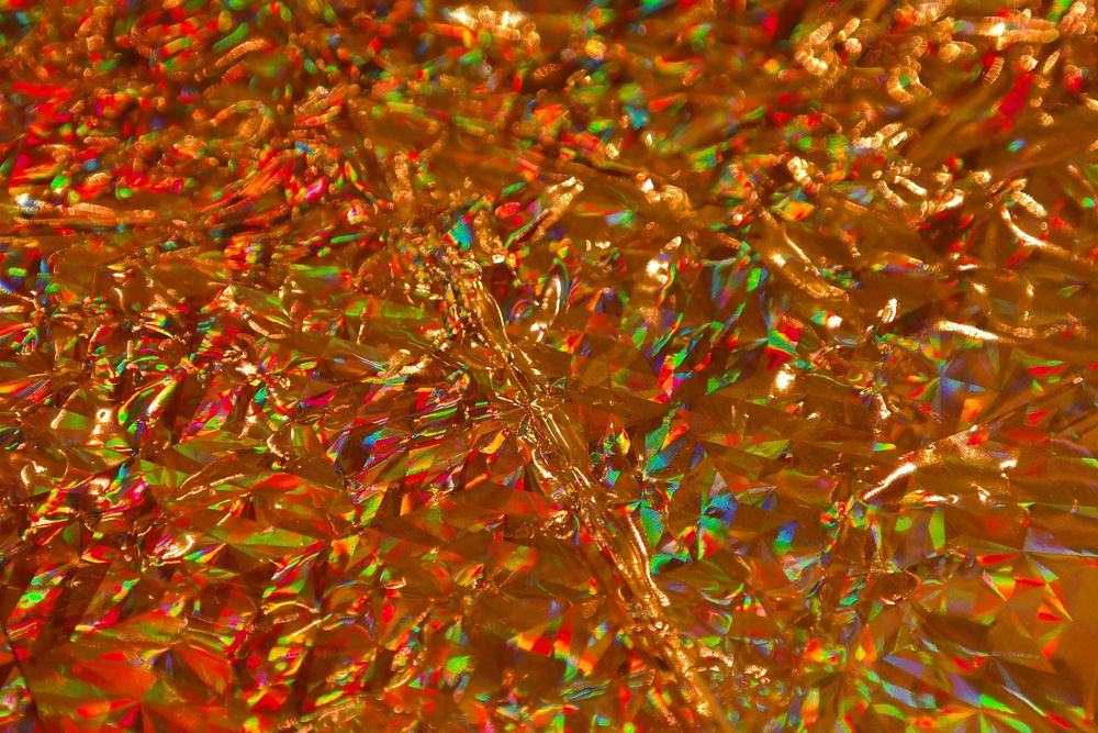 Gold crumpled wrapping paper close up. Free public domain CC0 photo.