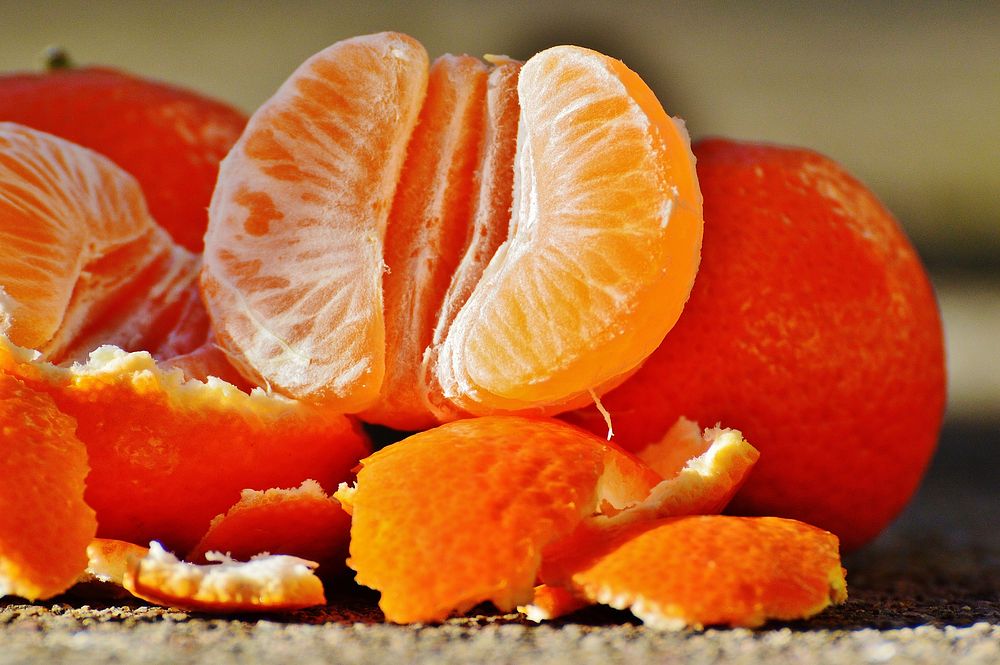 Closeup on mandarin orange peeled open. Free public domain CC0 photo.