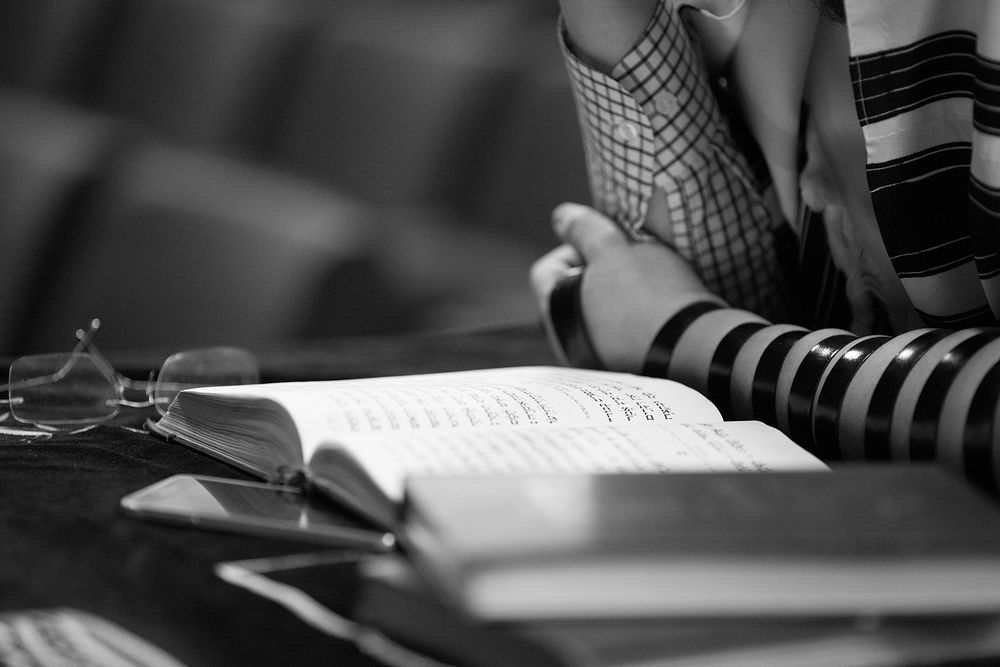 Woman reading a prayer book. Free public domain CC0 image.