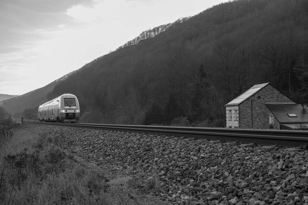 Moving train on a track. Free public domain CC0 photo.