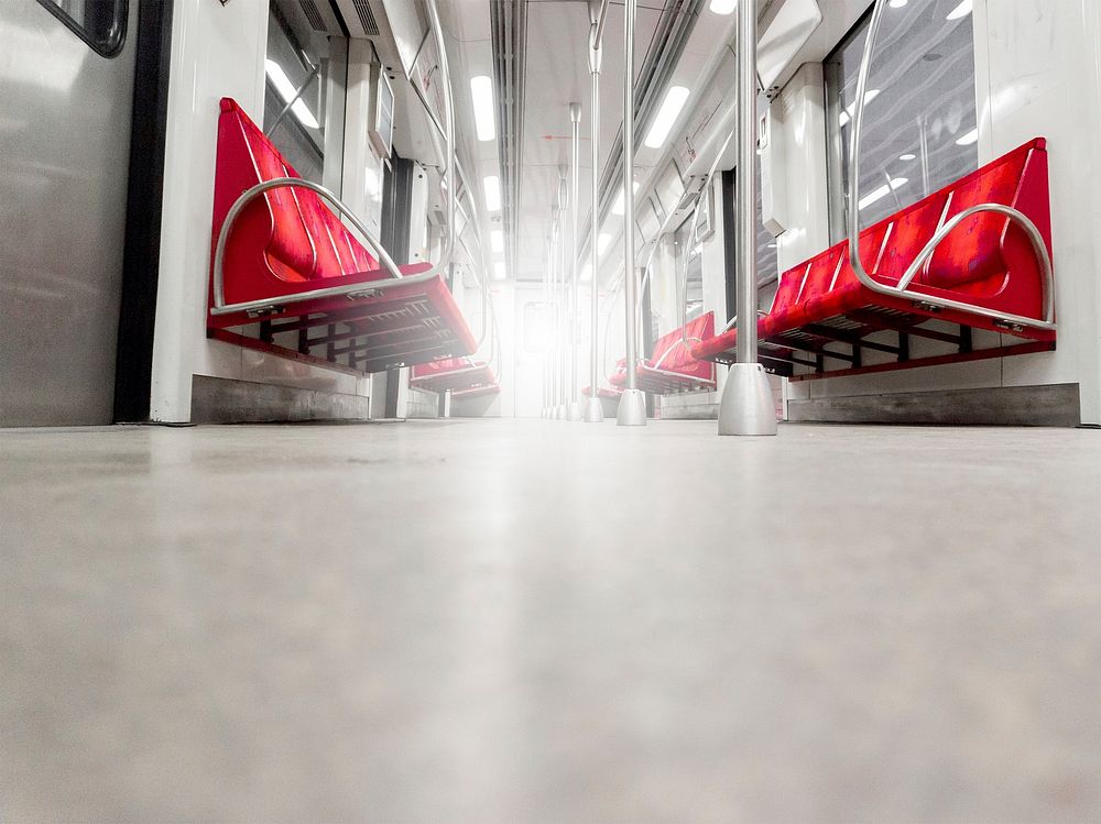 Free empty metro train with red seats public domain CC0 photo.
