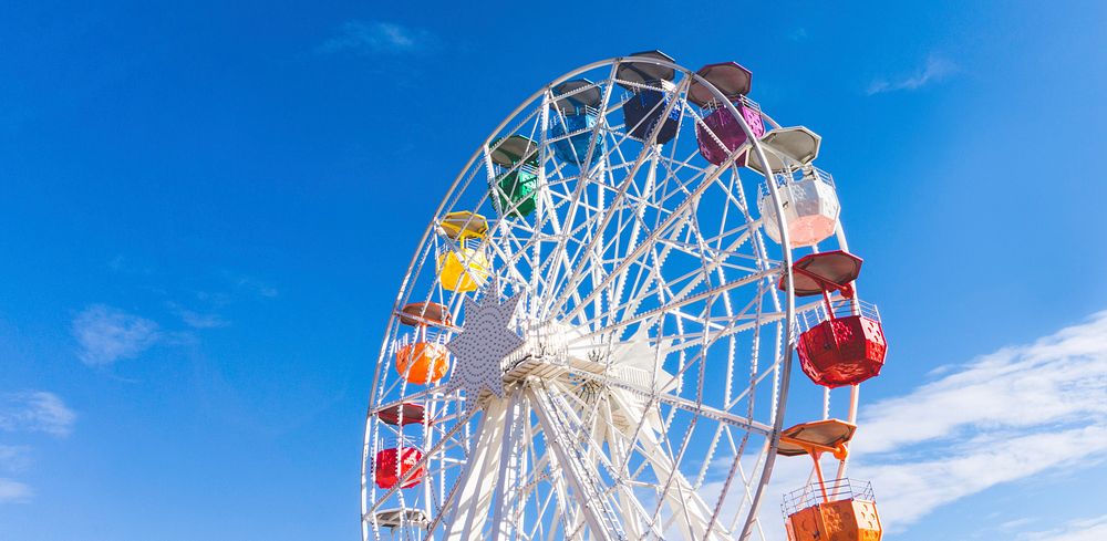 The structure of Ferris wheel with clear blue sky in the background, free public domain CC0 image.