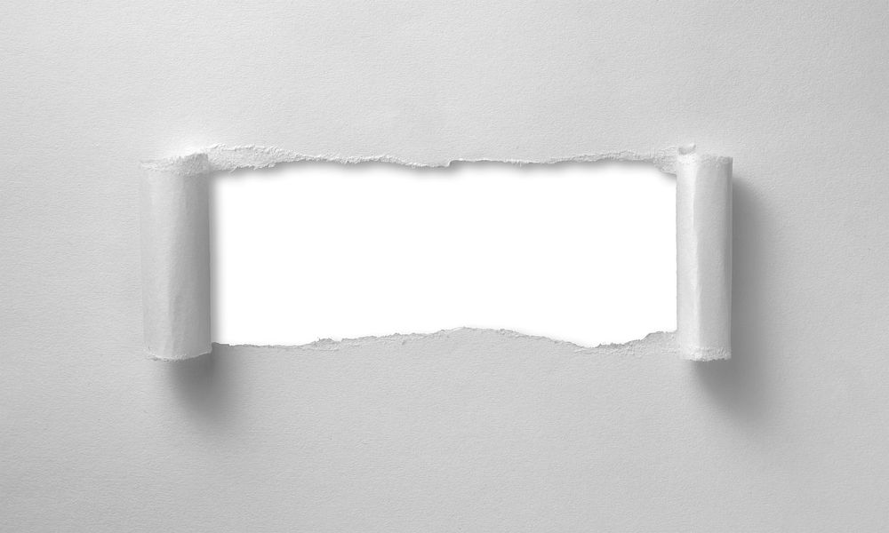 A hole ripped through a paper sheet resulting in paper curls, free public domain CC0 image.