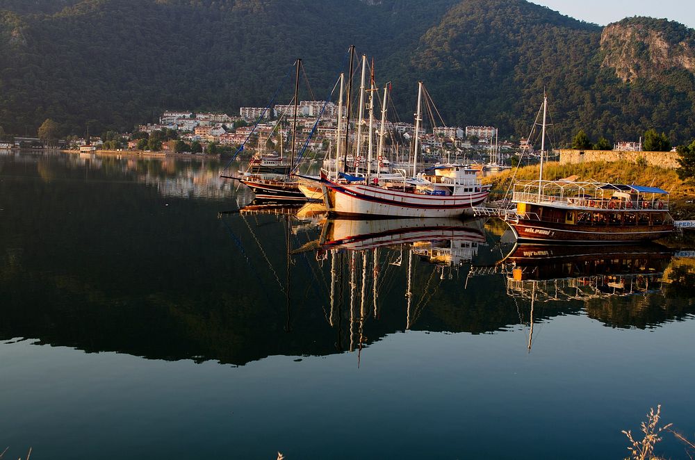 Boat docked by the port. Free public domain CC0 photo.