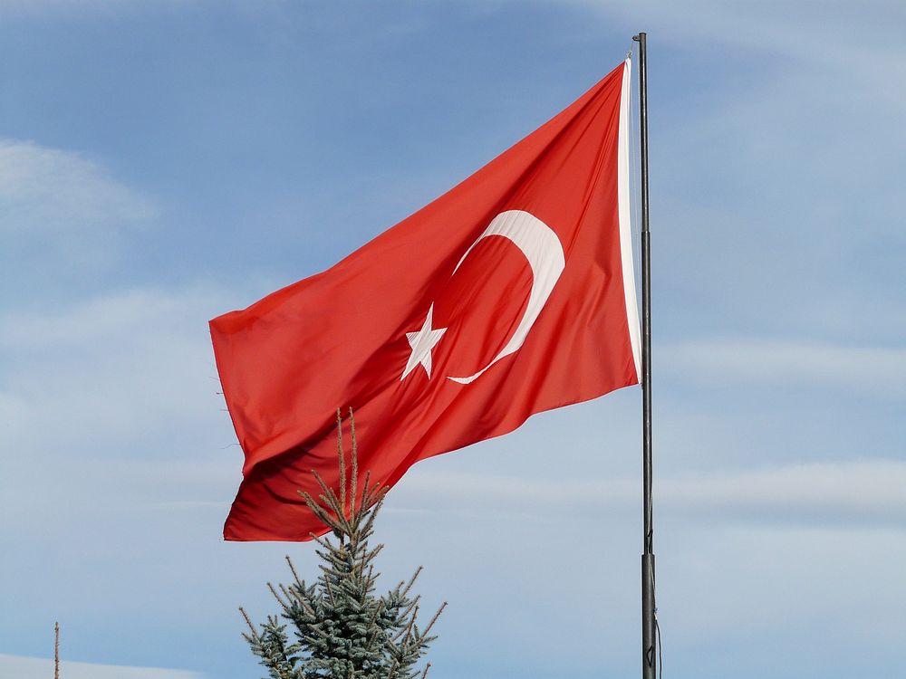 Turkish flag against blue sky. Free public domain CC0 photo