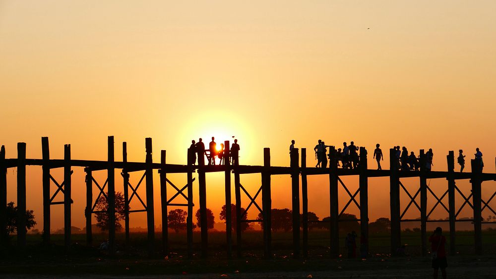 People on pier at sunset. Free public domain CC0 photo.