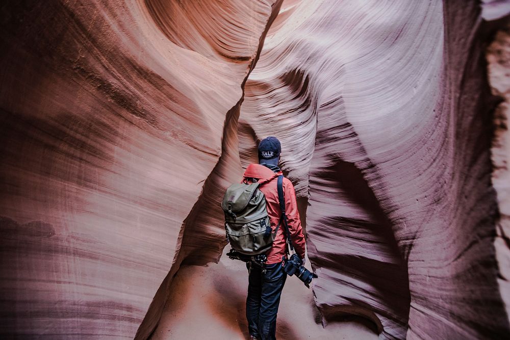 Man standing in sandstone canyon, free public domain CC0 photo