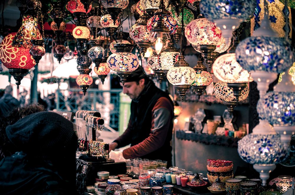 Man selling Moroccan home decor at market- unknown date & location